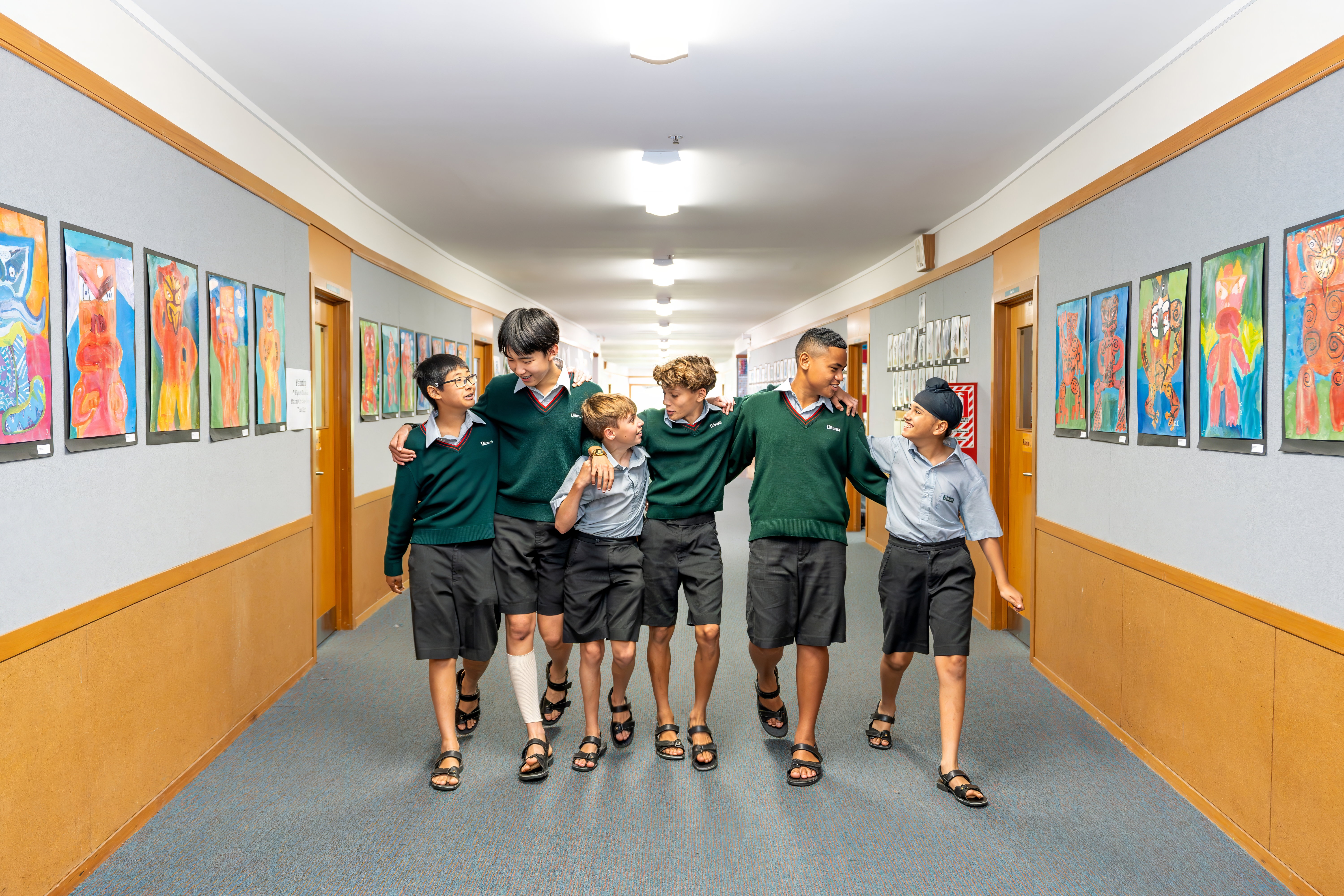 boys walking down a school hallway