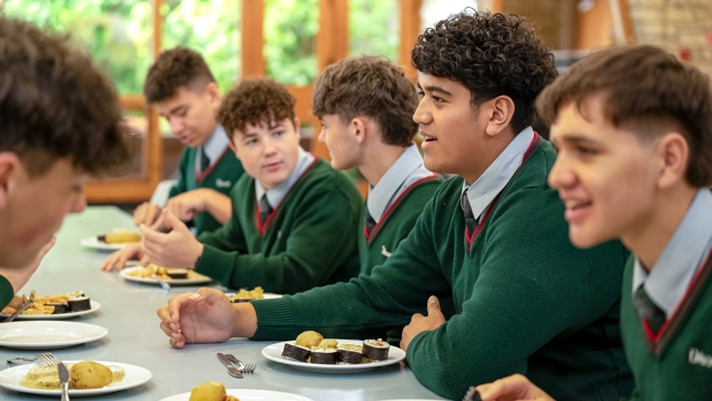 boys eating lunch in the dining hall