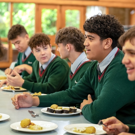 boys eating lunch in the dining hall