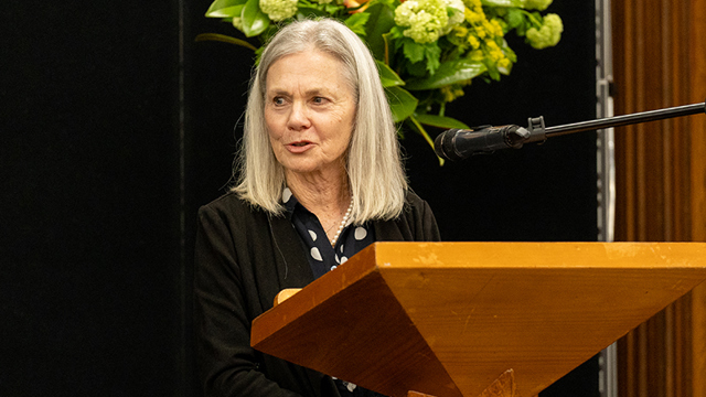 School Counsellor standing at a lectern