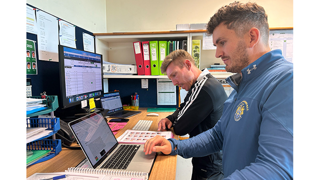 Teachers sitting at their desk working 